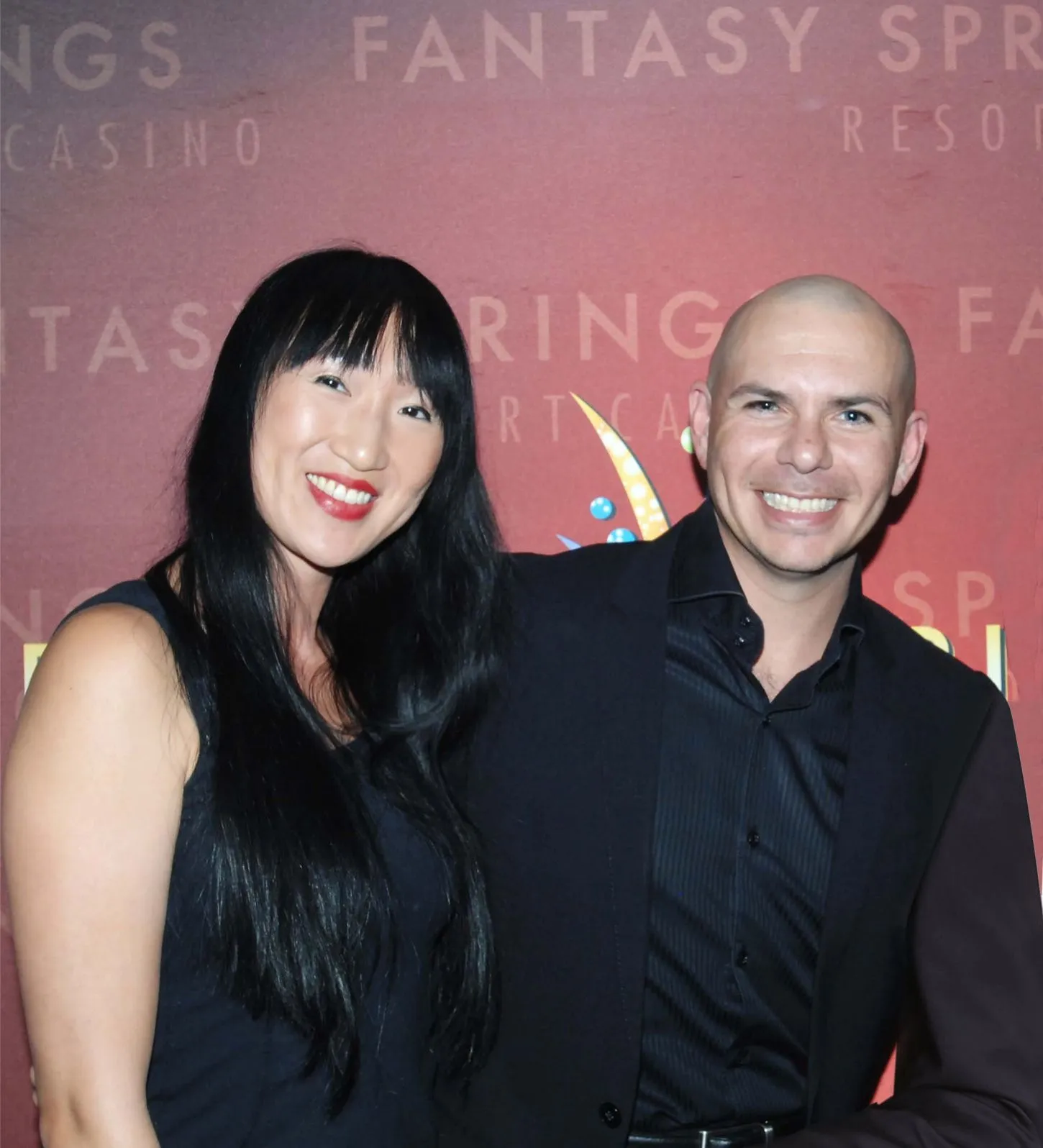 Karin with Pitbull at a live event